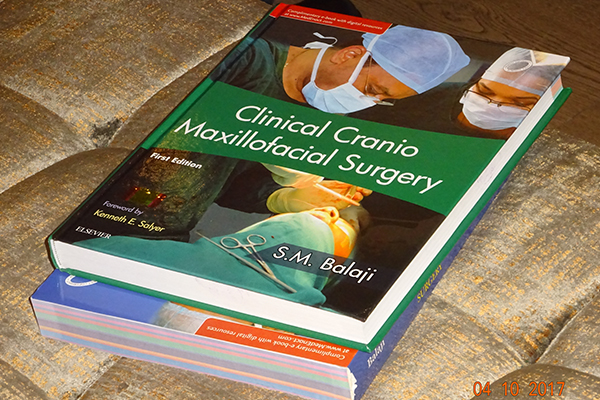 Clinical Cranio-Maxillary Surgery textbook, the first craniomaxillofacial surgery textbook by an Indian author and also the first by a single author.