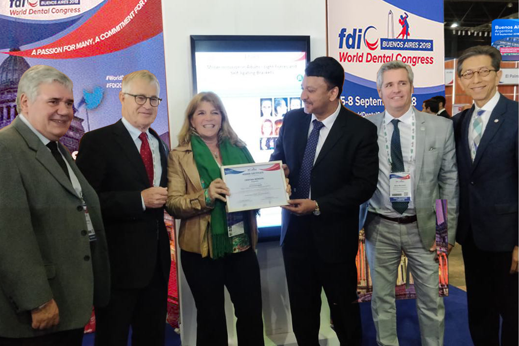 Dr Sm Balaji Hands A Certificate Of Excellence To A Winner. Also Seen Are Dr. Jurgen Fedderwitz, Chair, Education Committee, Fdi, Dr. Guillermo Rivero, Congress President, Dr William Cheung, Member, Education Committee And Dr Brian Murdoch, Member, Scientific Committee