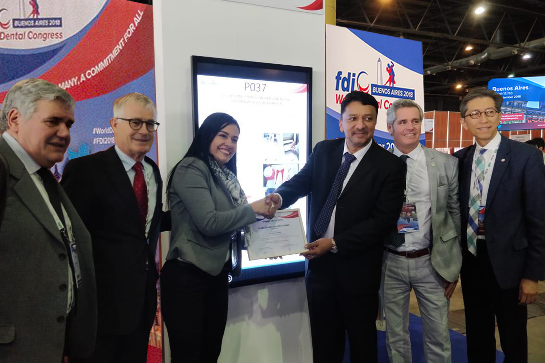 Dr Sm Balaji Hands A Certificate Of Excellence To A Winner. Also Seen Are Dr. Jurgen Fedderwitz, Chair, Education Committee, Fdi, Dr. Guillermo Rivero, Congress President, Dr William Cheung, Member, Education Committee And Dr Brian Murdoch, Member, Scientific Committee