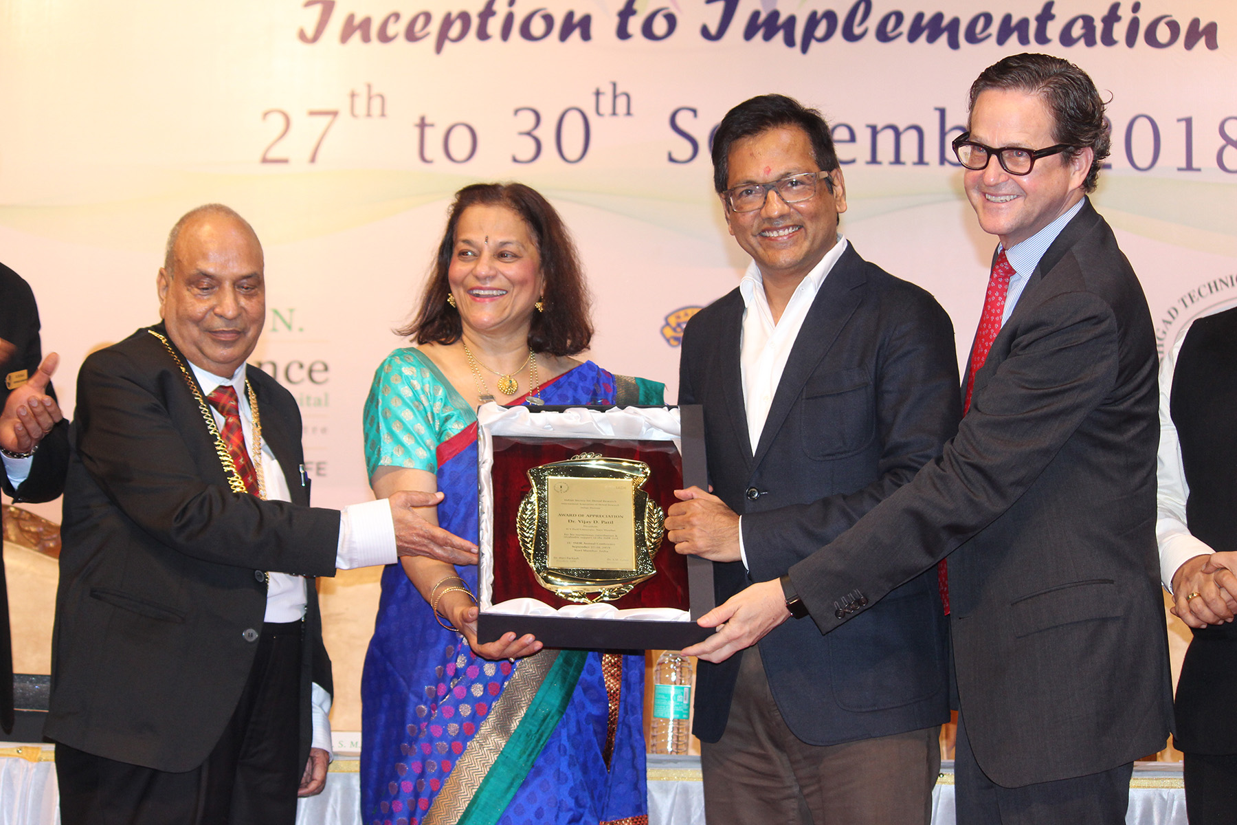 31st Indian Society for Dental Research - International Association for Dental Research Annual Conference, Mumbai 2 Prof Rena D’souza, President, Iadr Presenting Award Of Appreciation To Dr Vijay Patil, Chief Guest And Chancellor Of Dr Dy Patil University