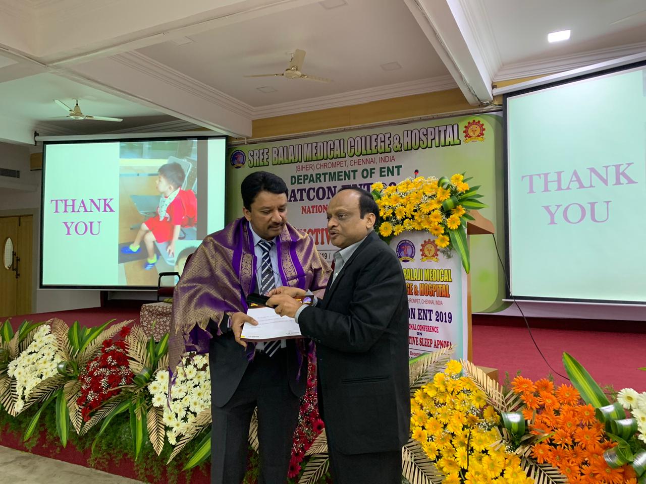 Dr SM Balaji receiving certificate of participation